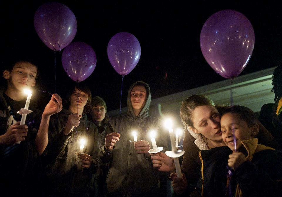 Family gathers in vigil to remember homicide victim